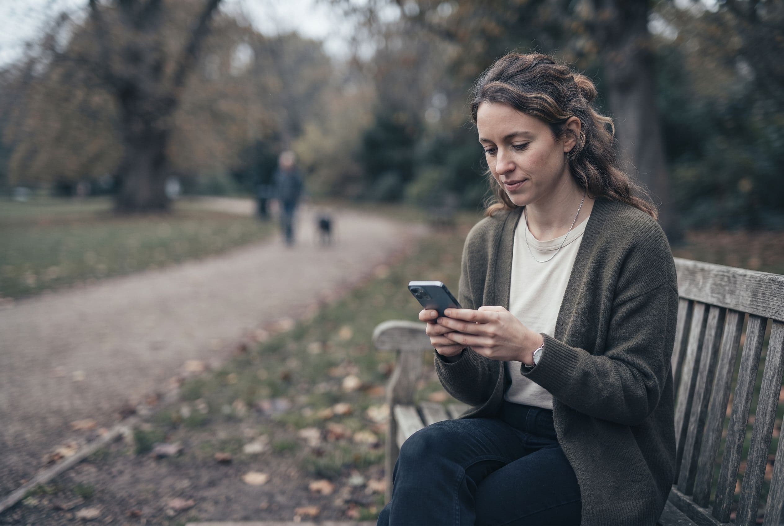 A candidate completing an application on their phone outdoors