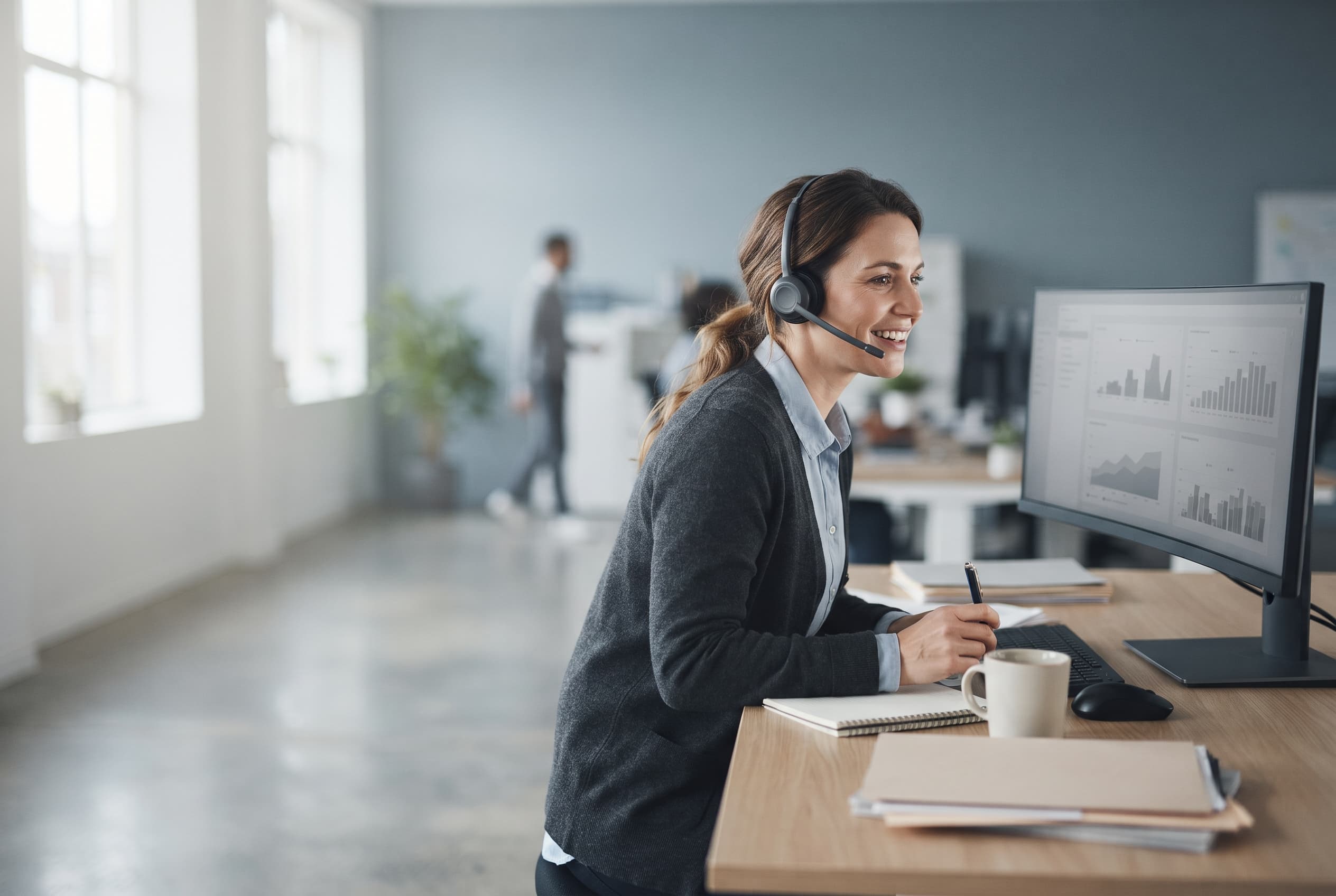 A support specialist at their desk working through a client request